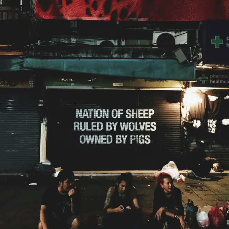 Bangkok street art: Nation of sheep, ruled by wolves, owned by pigs.
