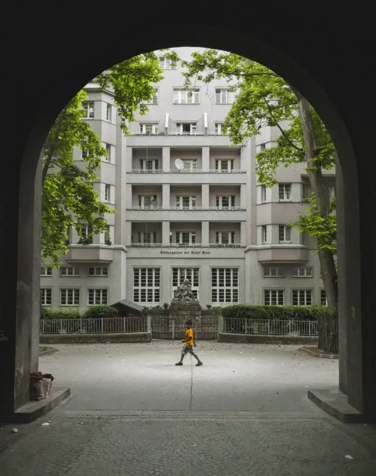 Kid walking in the middle of a courtyard