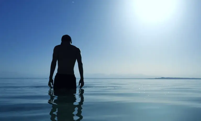 Silhouette of a person in the sea.